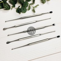 Curette for manicure with a spoon